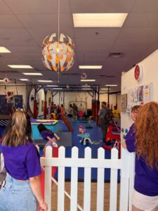 Families and children playing inside the sensory gym during the celebration